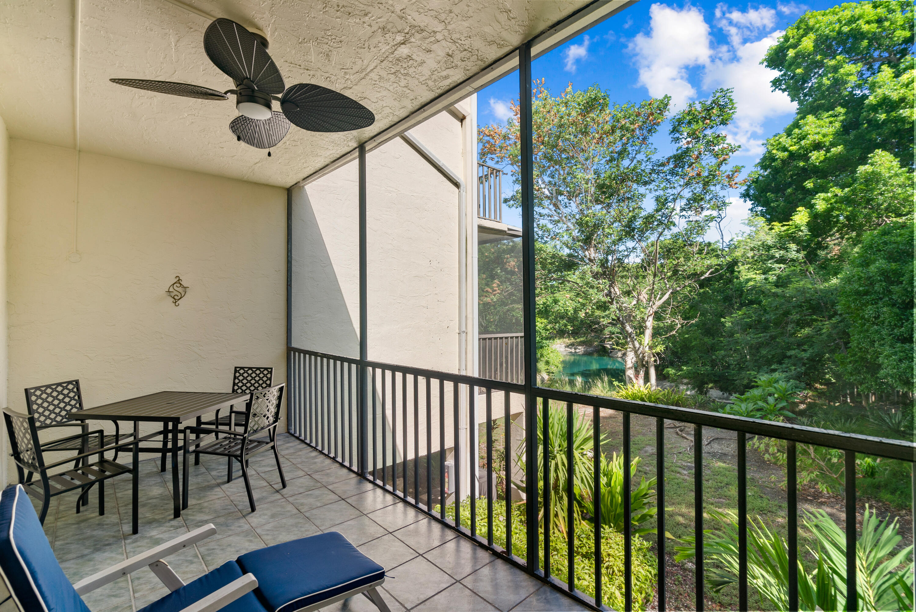 94220 Overseas Highway, Unit 5E Tavernier, FL 33037 - Photo 15 of 77 Screened patio off living area