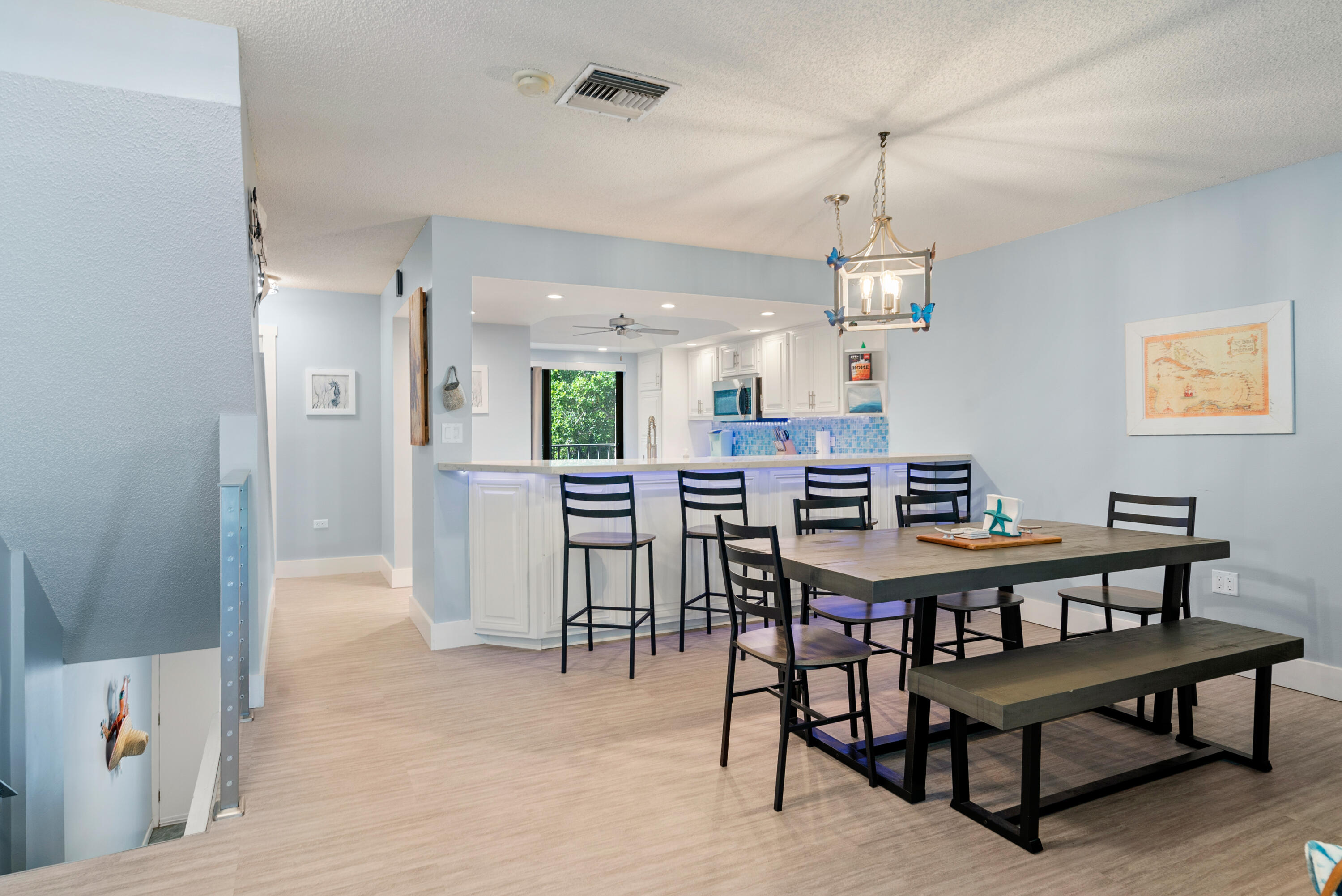 94220 Overseas Highway, Unit 5E Tavernier, FL 33037 - Photo 17 of 77 a view of a dining room with furniture