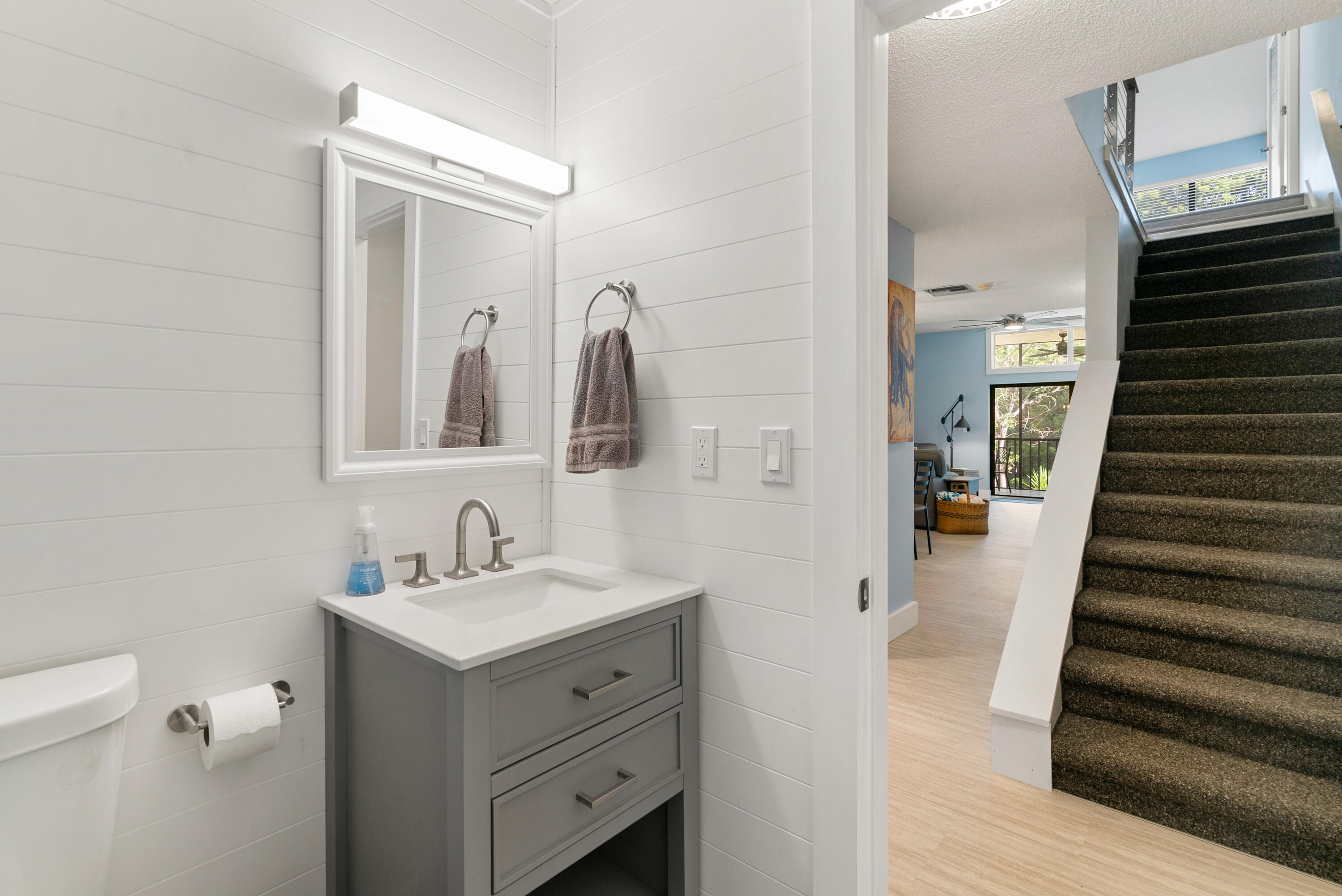 94220 Overseas Highway, Unit 5E Tavernier, FL 33037 - Photo 23 of 77 a bathroom with a sink and a mirror