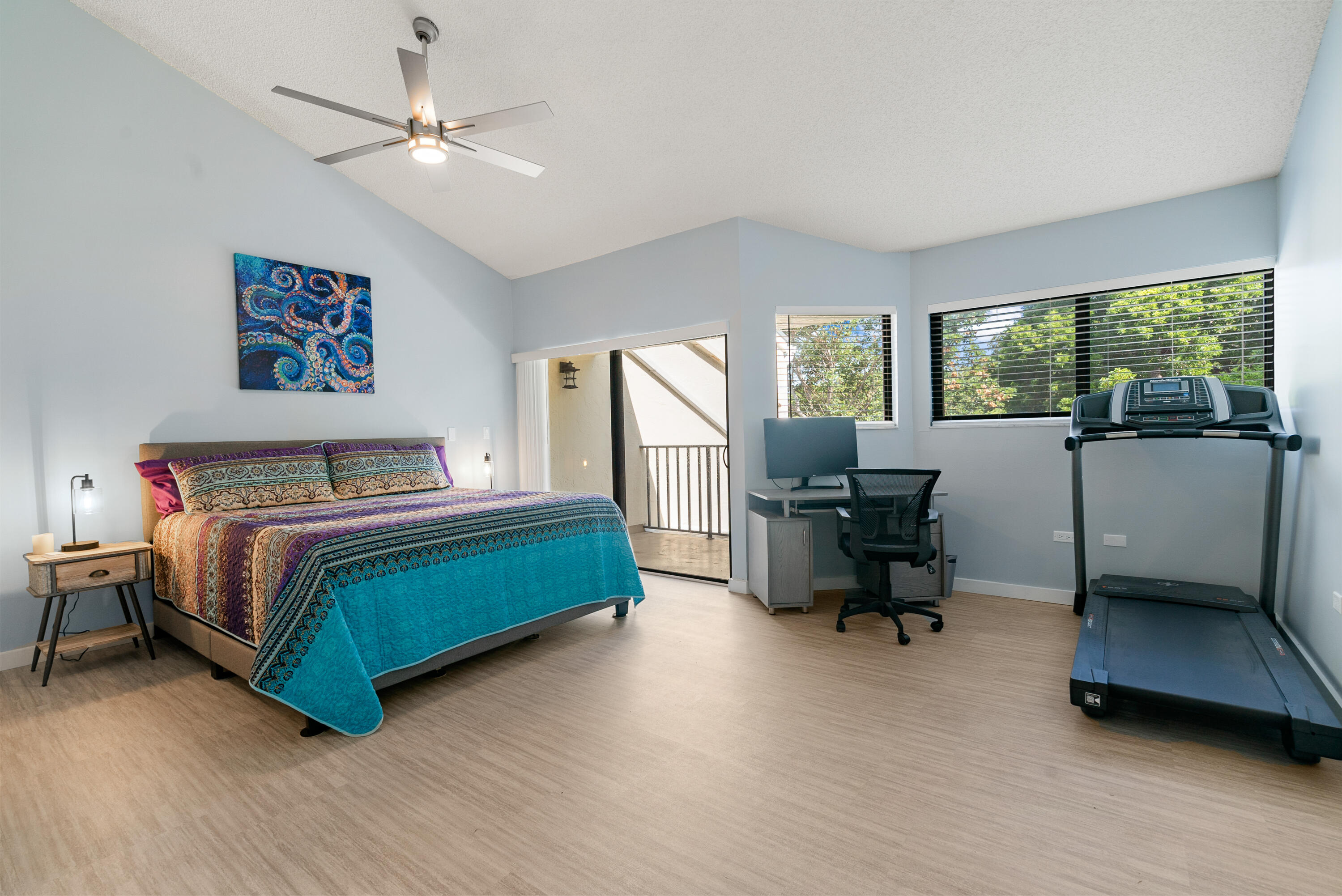 94220 Overseas Highway, Unit 5E Tavernier, FL 33037 - Photo 25 of 77 a bedroom with a bed and a chair
