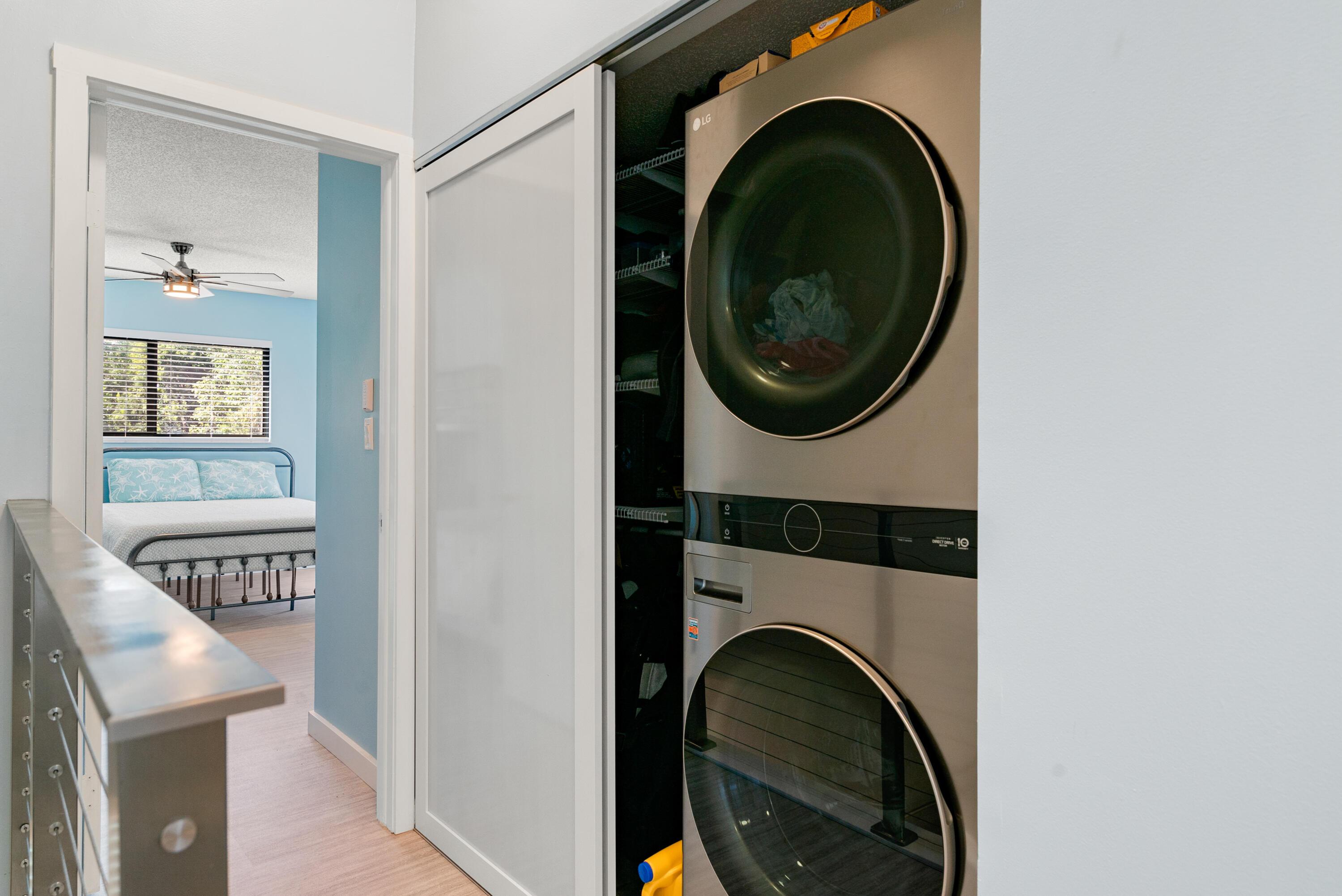 94220 Overseas Highway, Unit 5E Tavernier, FL 33037 - Photo 32 of 77 a view of a hallway with washer and dryer