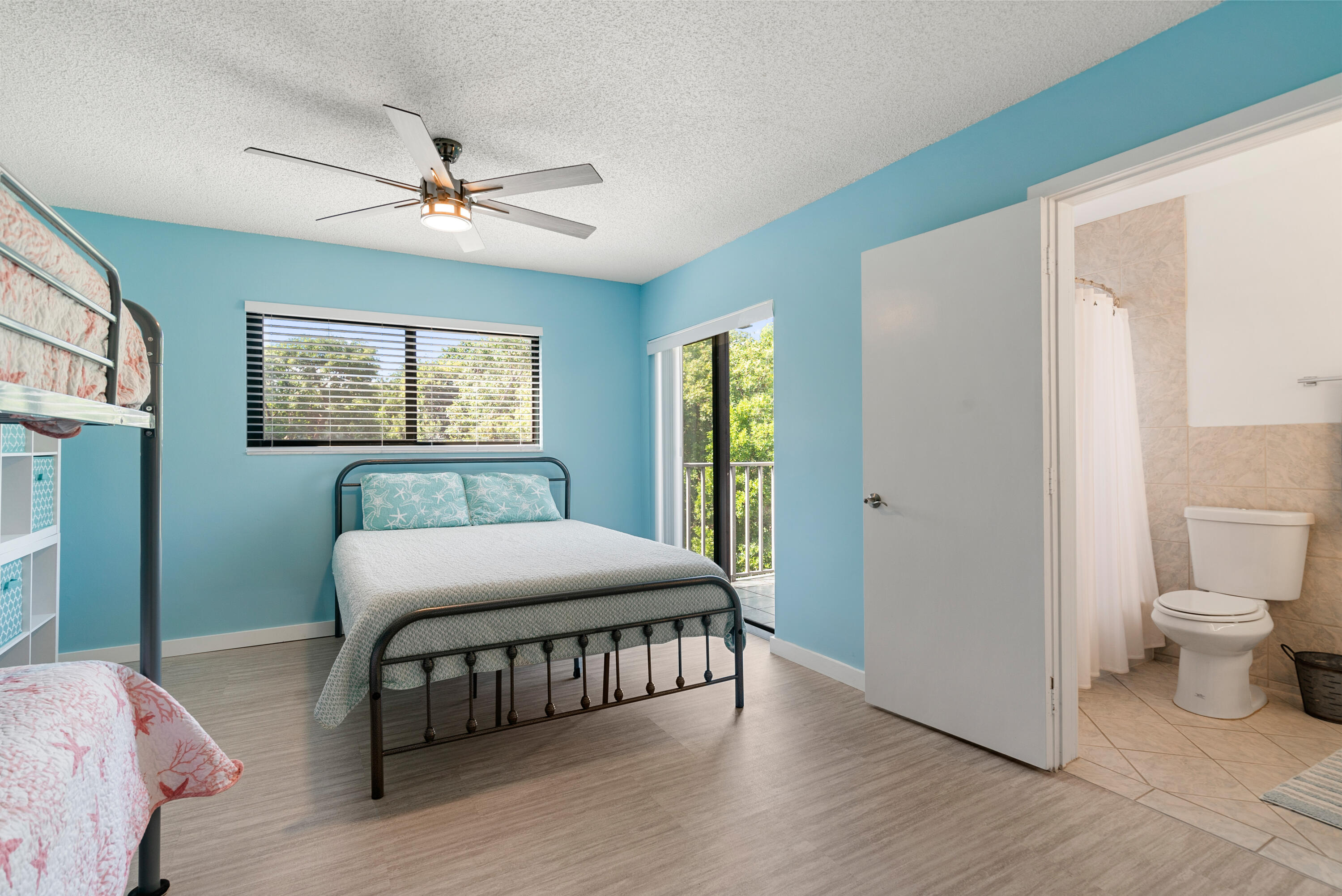94220 Overseas Highway, Unit 5E Tavernier, FL 33037 - Photo 33 of 77 a bedroom with a bed and a window