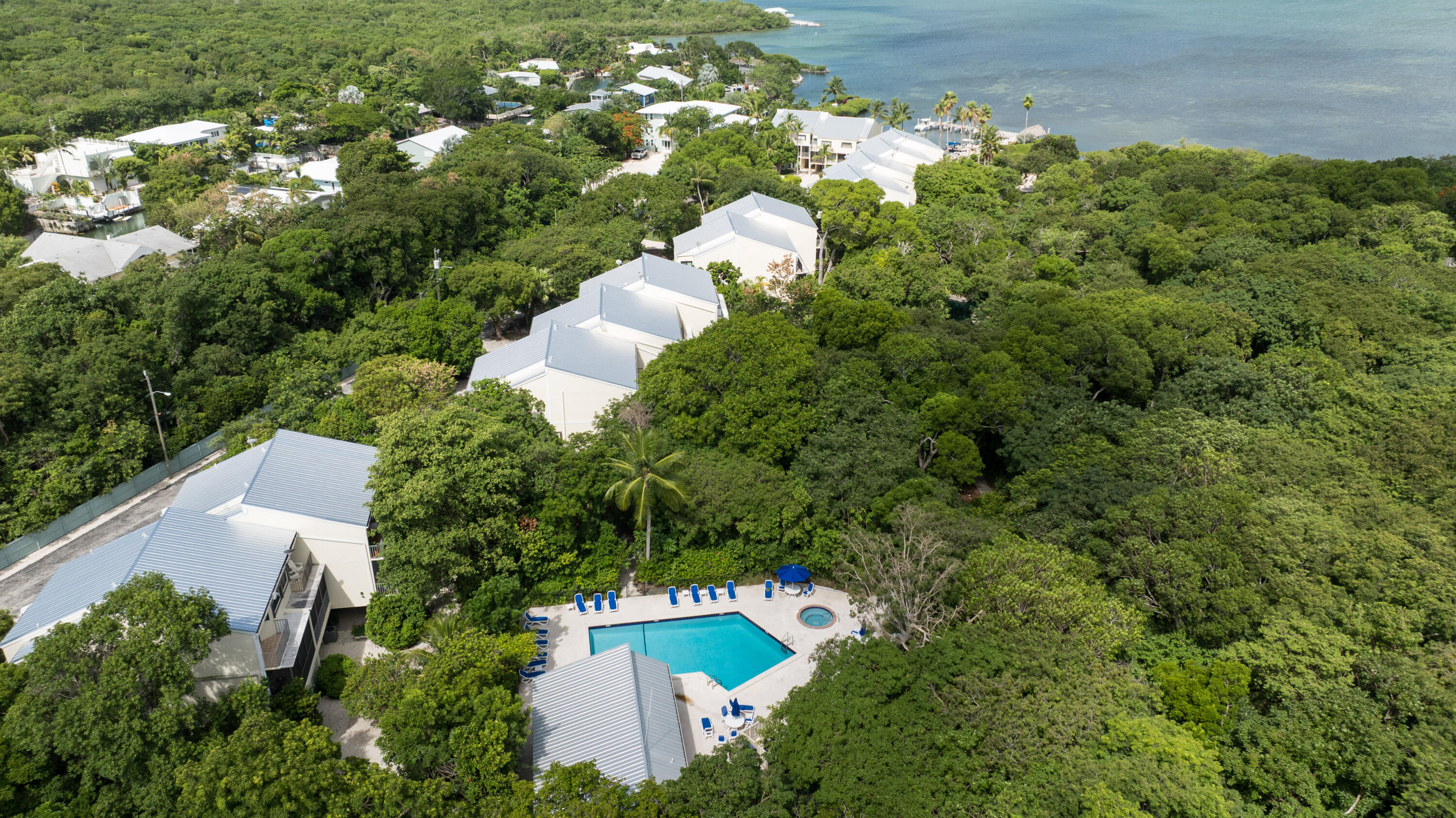 94220 Overseas Highway, Unit 5E Tavernier, FL 33037 - Photo 48 of 77 an aerial view of a house with yard swimming pool and outdoor seating
