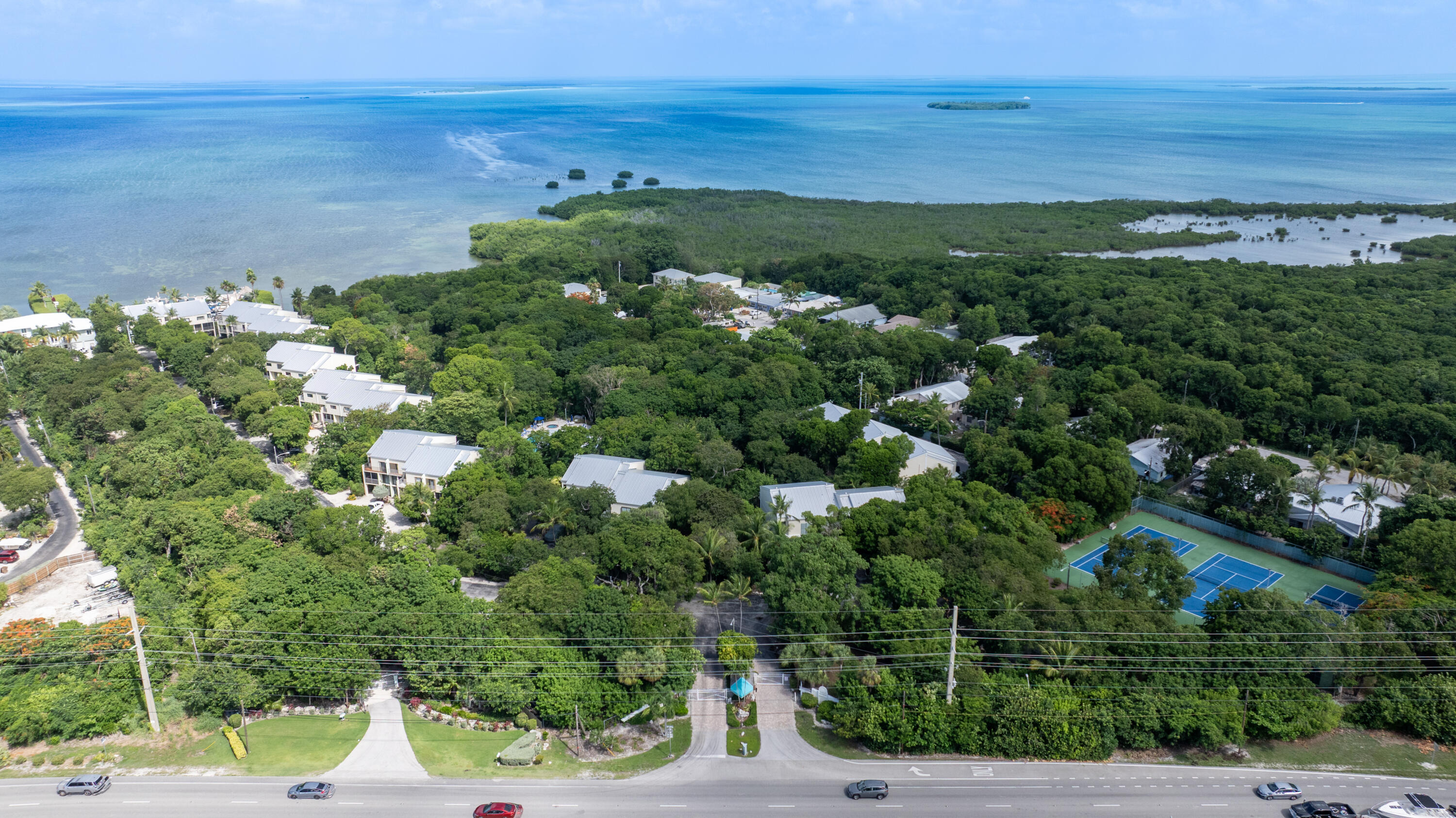 94220 Overseas Highway, Unit 5E Tavernier, FL 33037 - Photo 67 of 77 a view of a yard with an outdoor space