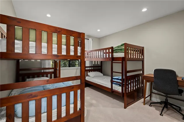 a bedroom with furniture and a window