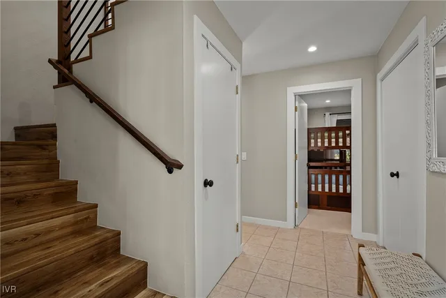 a view of entryway and hall with wooden floor