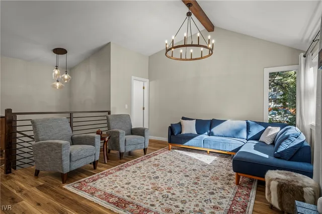 a living room with furniture and a rug