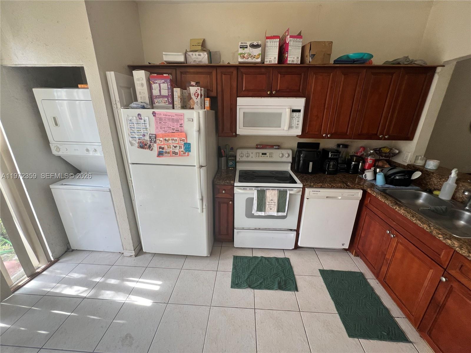 1596 Southwest 2nd Street Homestead, FL 33030 - Photo 11 of 42 a view of a kitchen with fridge and rack