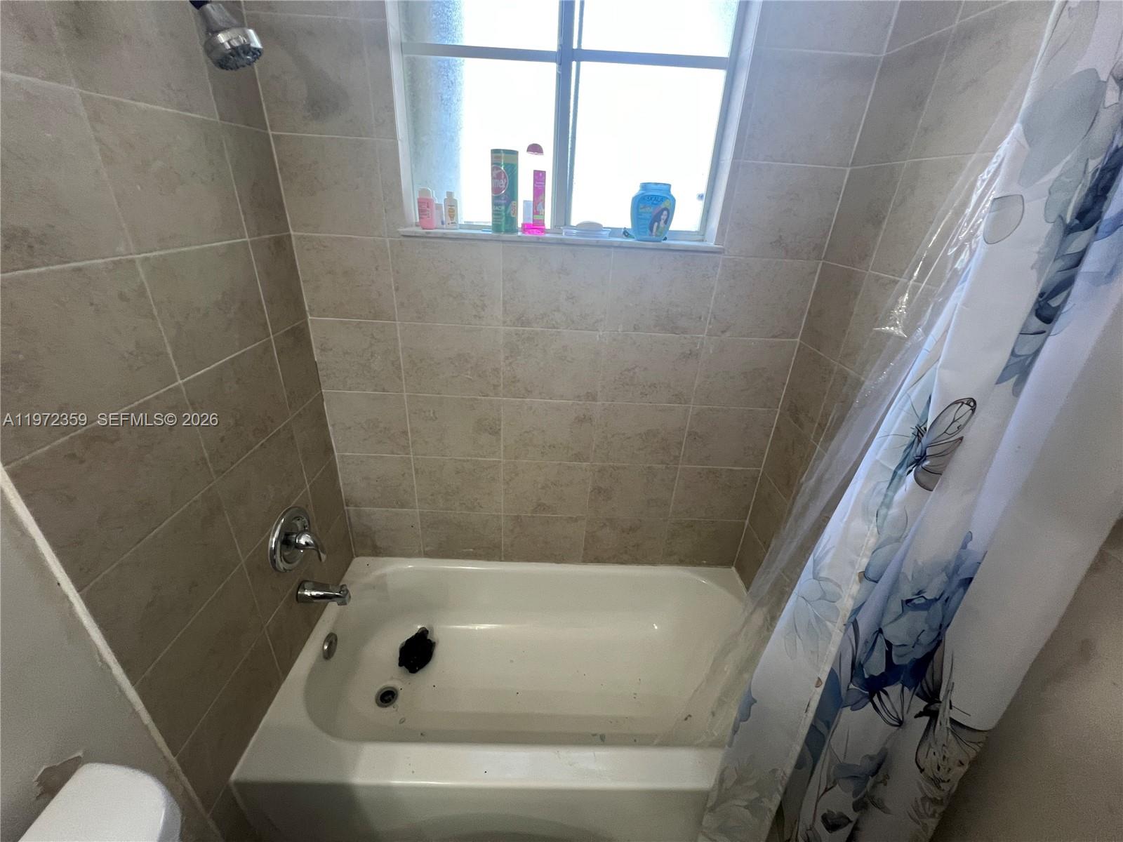 1596 Southwest 2nd Street Homestead, FL 33030 - Photo 20 of 42 a bathroom with a bathtub