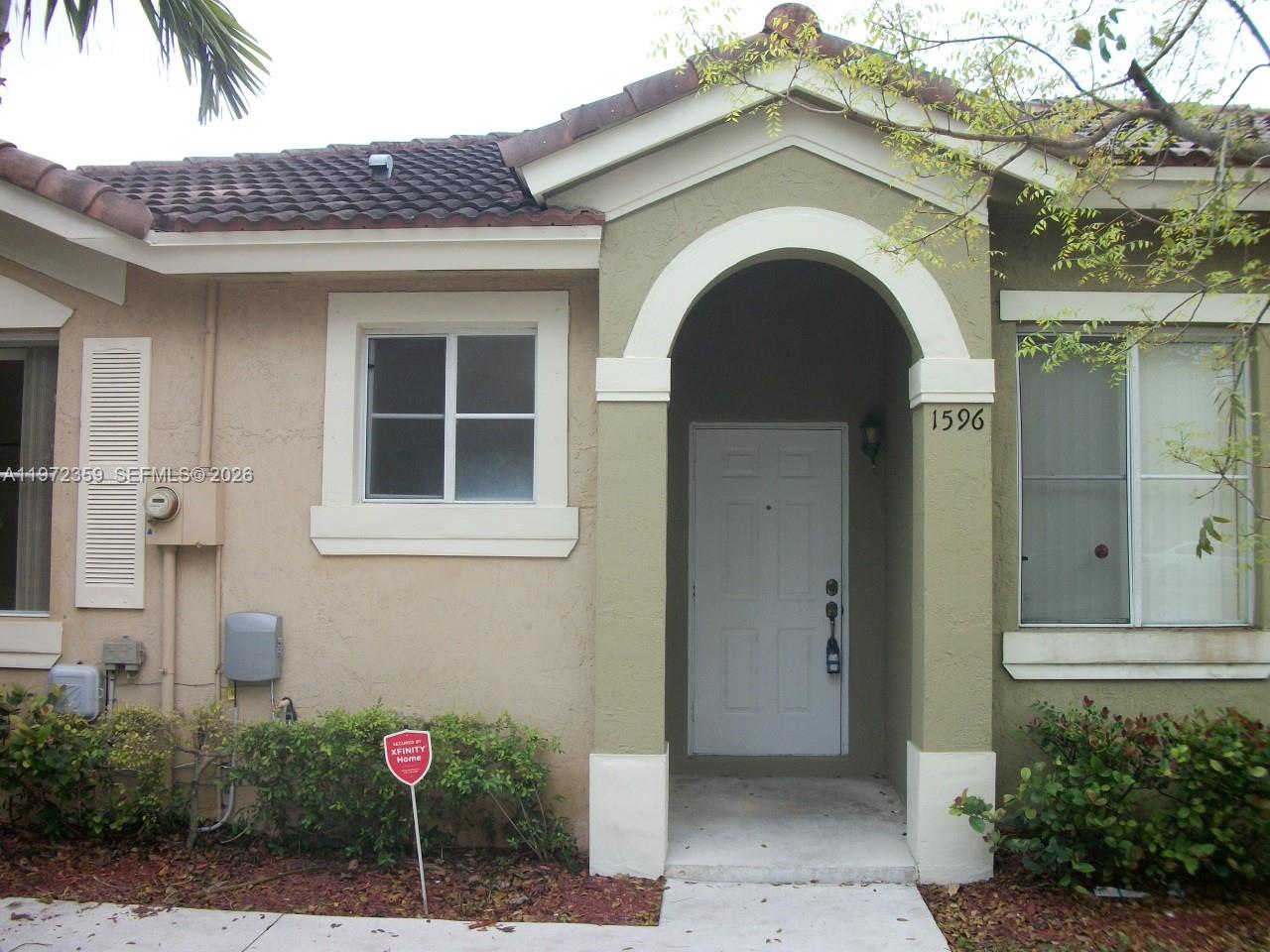 1596 Southwest 2nd Street Homestead, FL 33030 - Photo 2 of 42 a view of a house with a porch