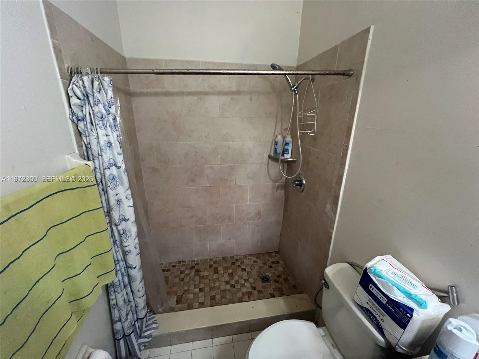 1596 Southwest 2nd Street Homestead, FL 33030 - Photo 34 of 42 a bathroom with a shower and a toilet