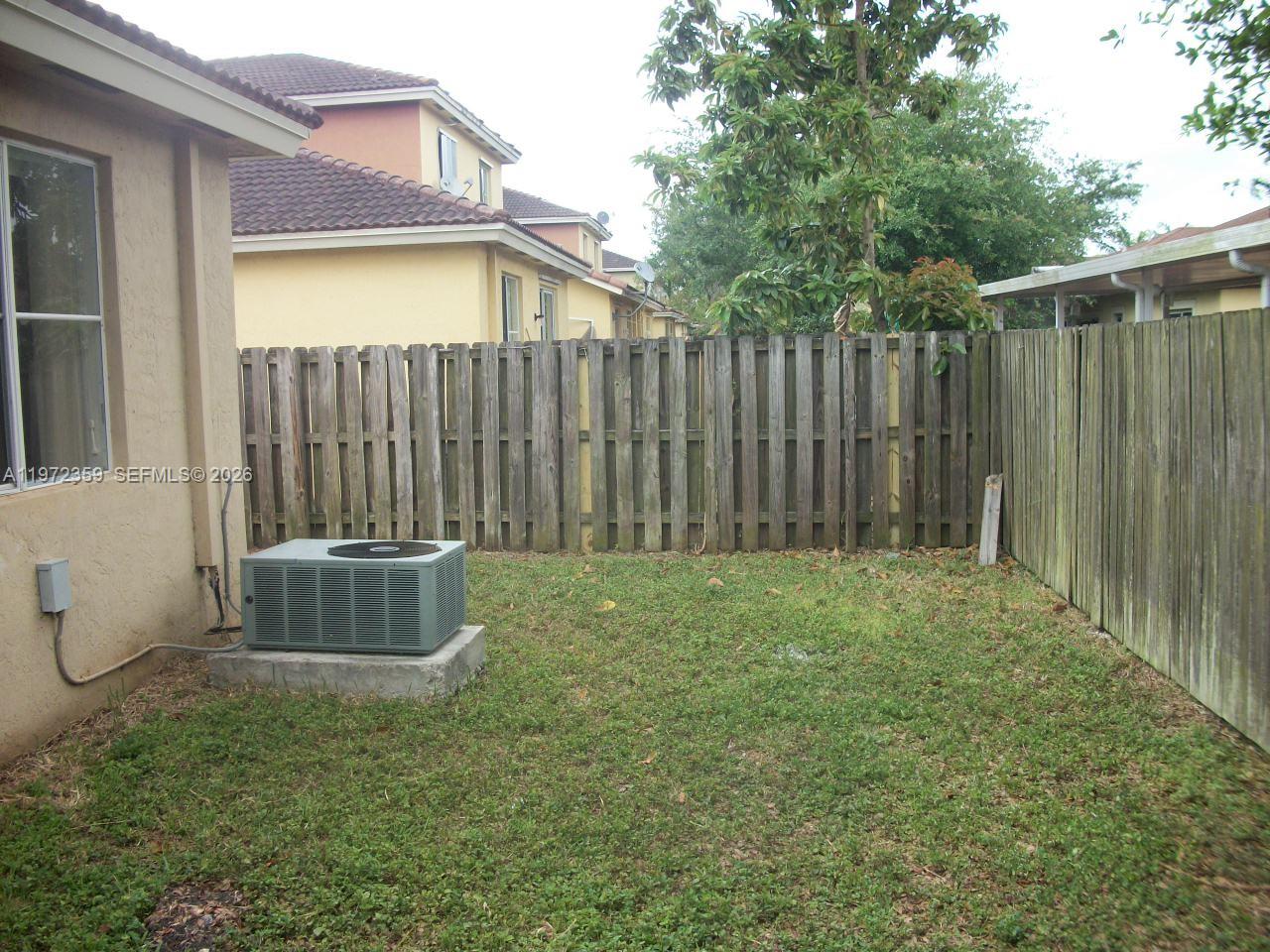 1596 Southwest 2nd Street Homestead, FL 33030 - Photo 9 of 42 a backyard of a house