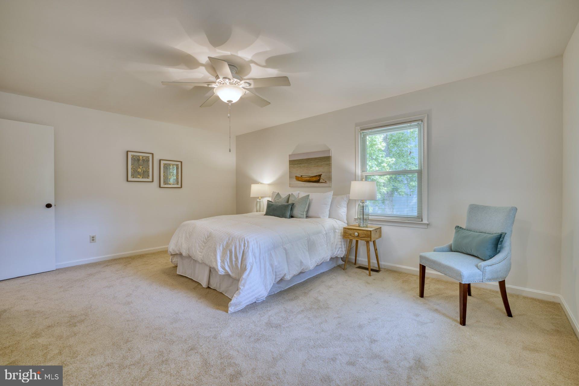 7725 Fordson Road Alexandria, VA 22306 - Photo 25 of 46 Primary bedroom w/ ceiling fan and plush carpet