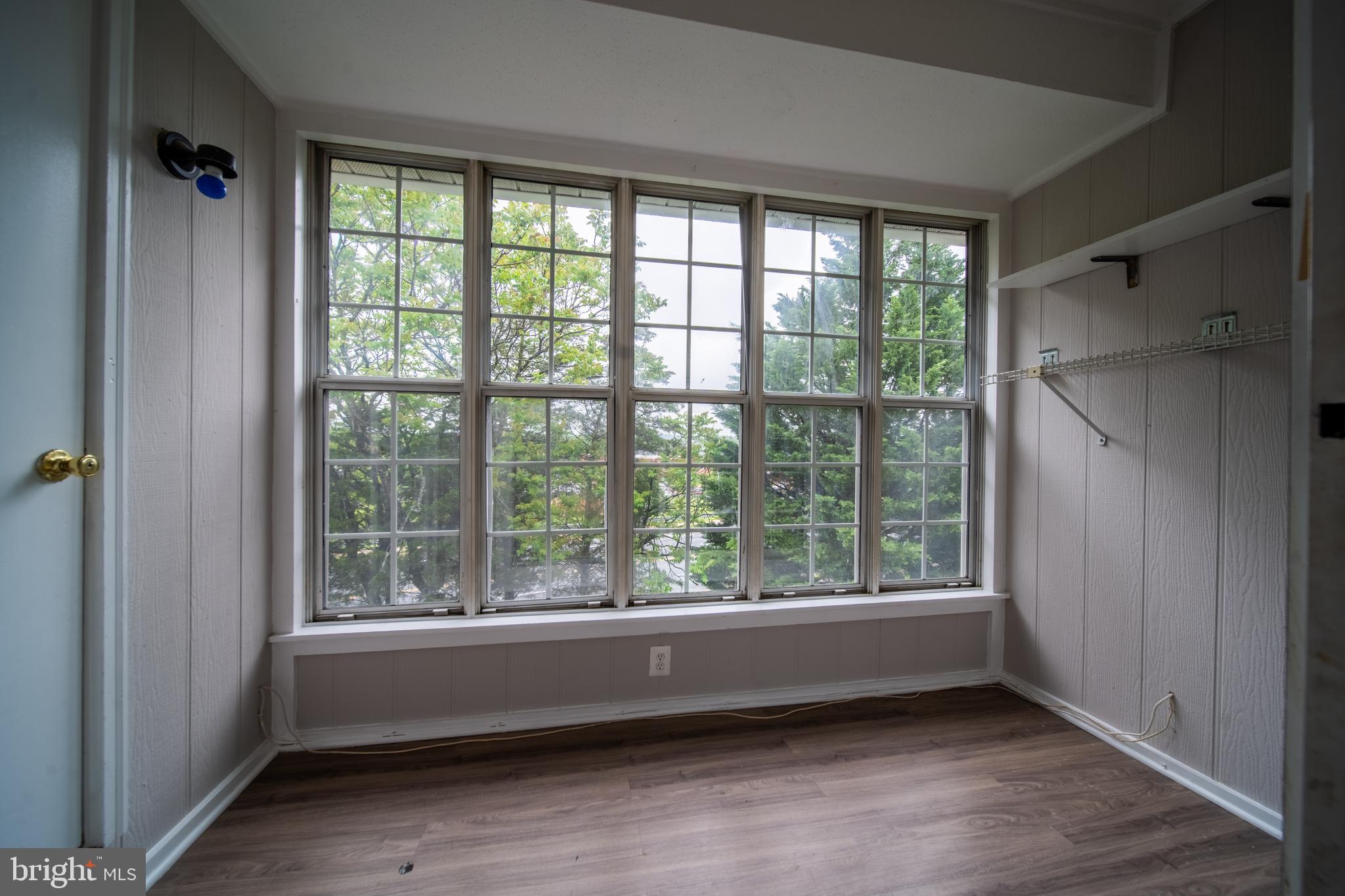120 Fort Evans Road Southeast, Unit E Leesburg, VA 20175 - Photo 13 of 29 a view of room with window and hardwood floor