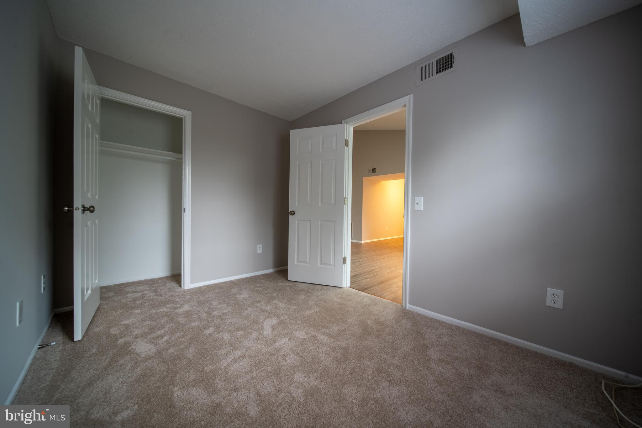 120 Fort Evans Road Southeast, Unit E Leesburg, VA 20175 - Photo 14 of 29 a view of an empty room and a window
