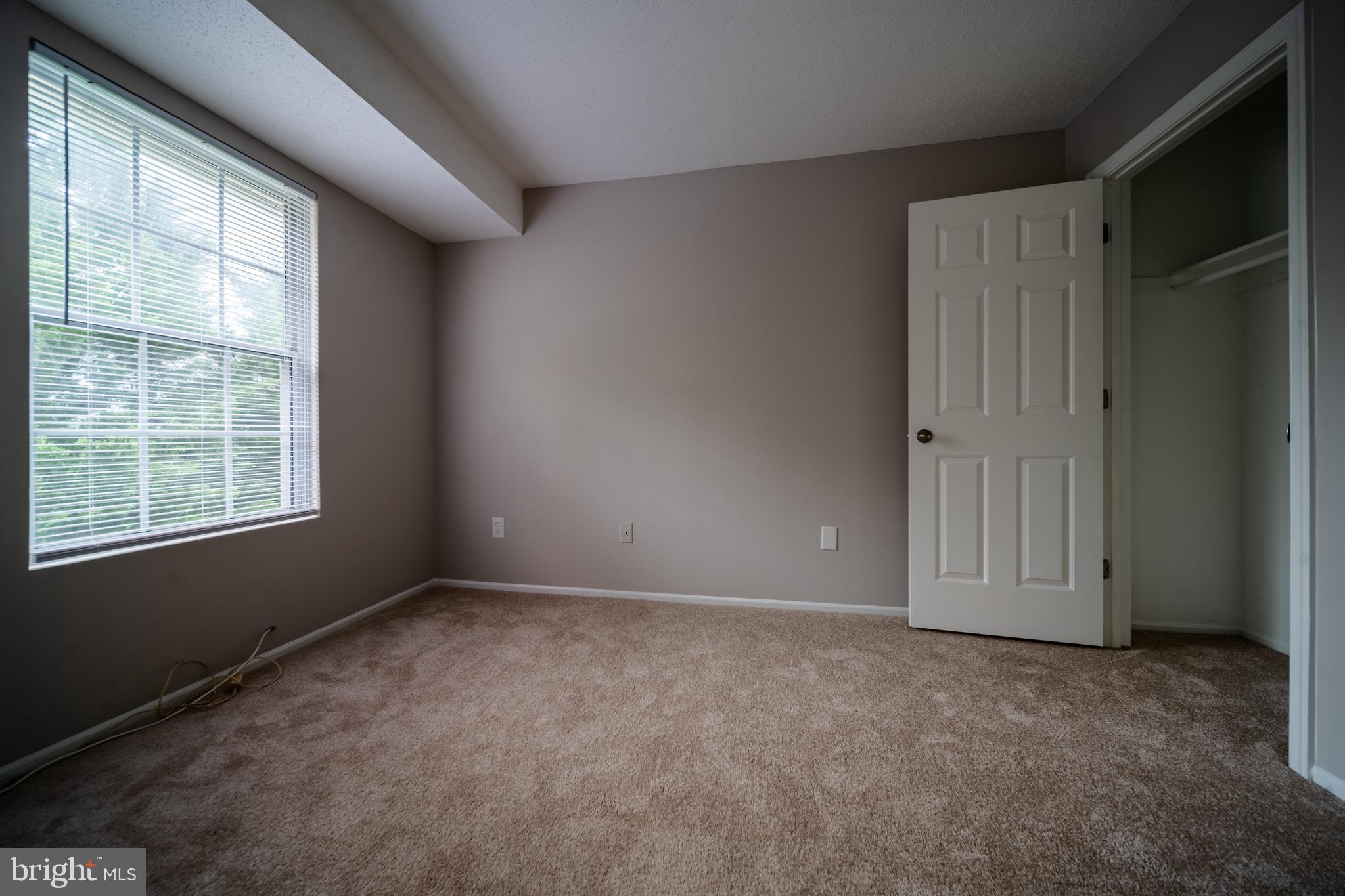 120 Fort Evans Road Southeast, Unit E Leesburg, VA 20175 - Photo 17 of 29 an empty room with windows