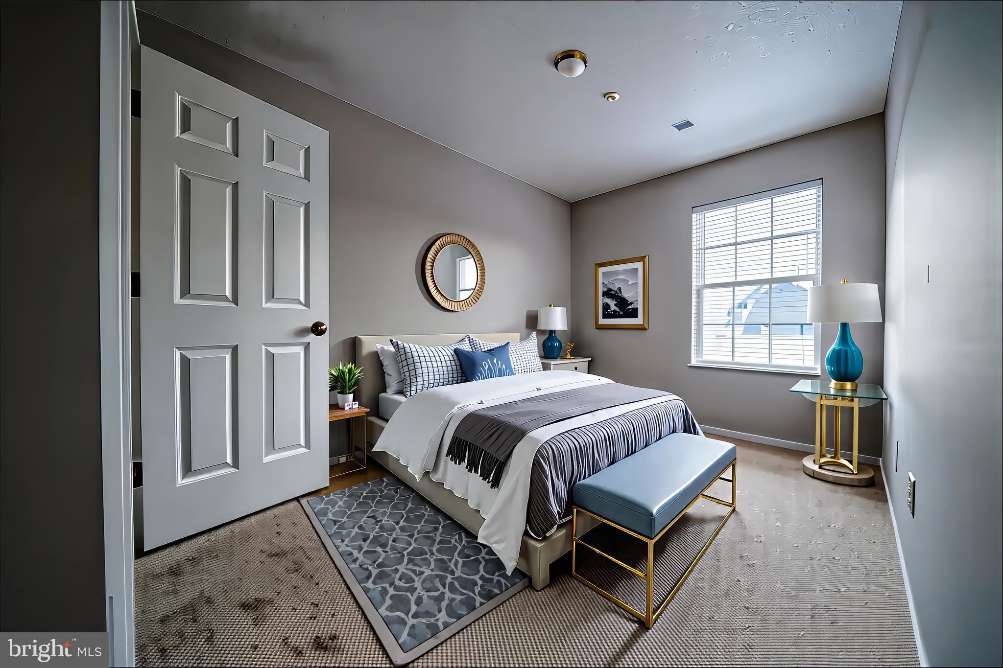 120 Fort Evans Road Southeast, Unit E Leesburg, VA 20175 - Photo 19 of 29 a bedroom with a bed a chandelier and mirror