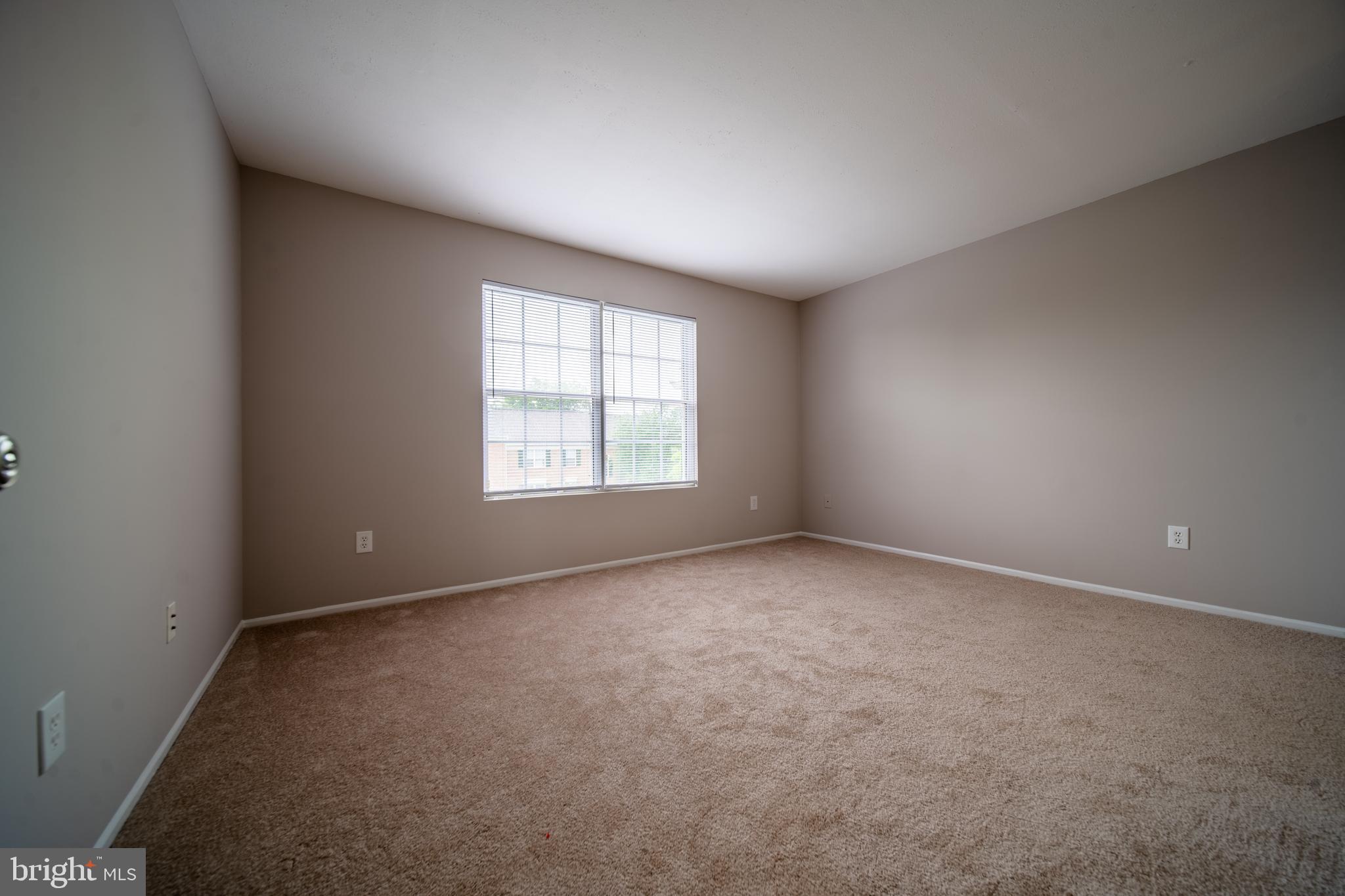 120 Fort Evans Road Southeast, Unit E Leesburg, VA 20175 - Photo 20 of 29 an empty room with a window