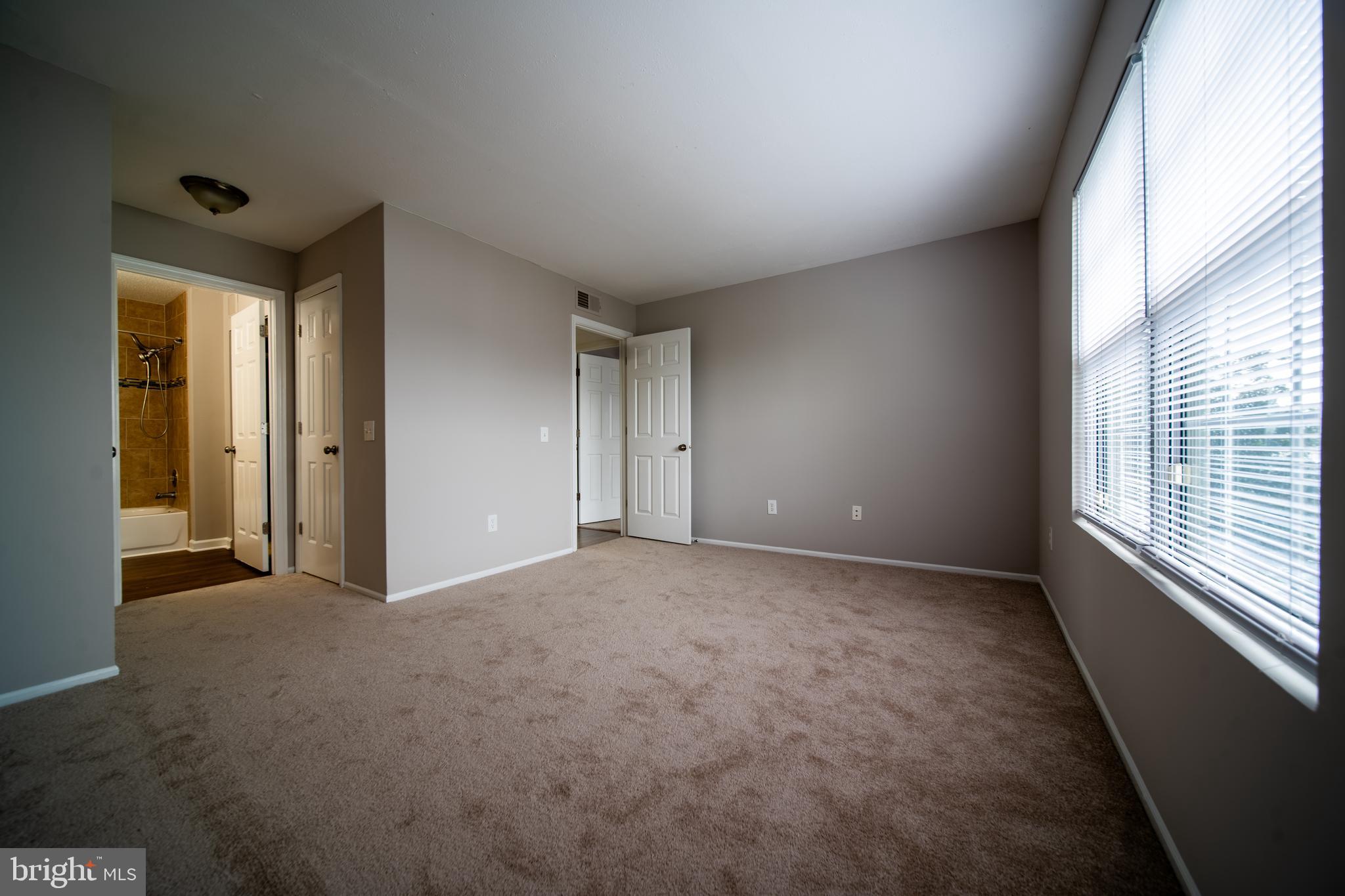 120 Fort Evans Road Southeast, Unit E Leesburg, VA 20175 - Photo 21 of 29 a view of an empty room with a window