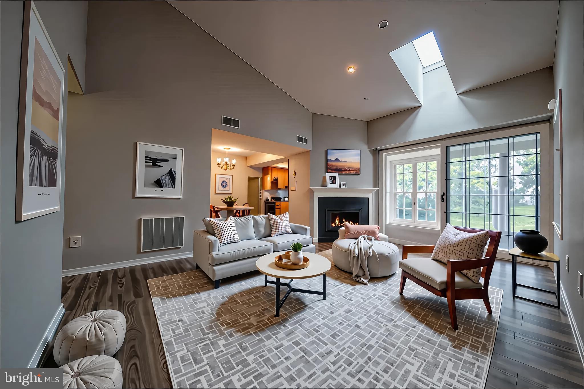 120 Fort Evans Road Southeast, Unit E Leesburg, VA 20175 - Photo 4 of 29 a living room with furniture a fireplace and a large window