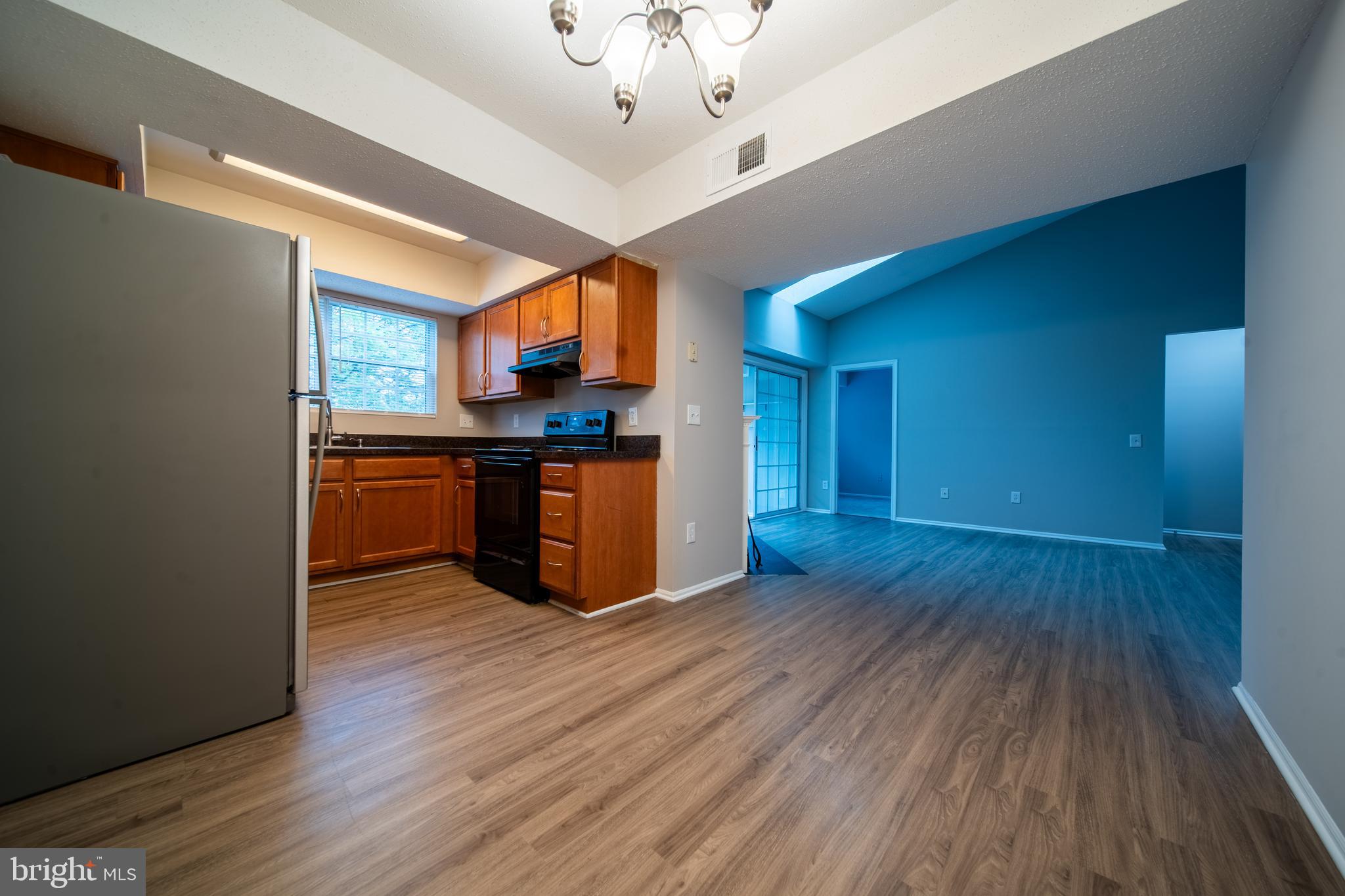 120 Fort Evans Road Southeast, Unit E Leesburg, VA 20175 - Photo 7 of 29 a view of kitchen with sink and wooden floor
