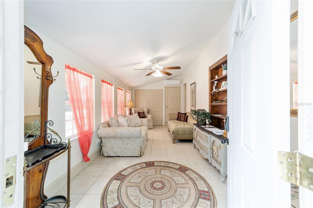 20693 Walnut Street Dunnellon, FL 34431 - Photo 18 of 51 a living room with furniture and a flat screen tv