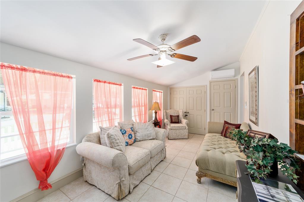 20693 Walnut Street Dunnellon, FL 34431 - Photo 19 of 51 a living room with furniture and a large window