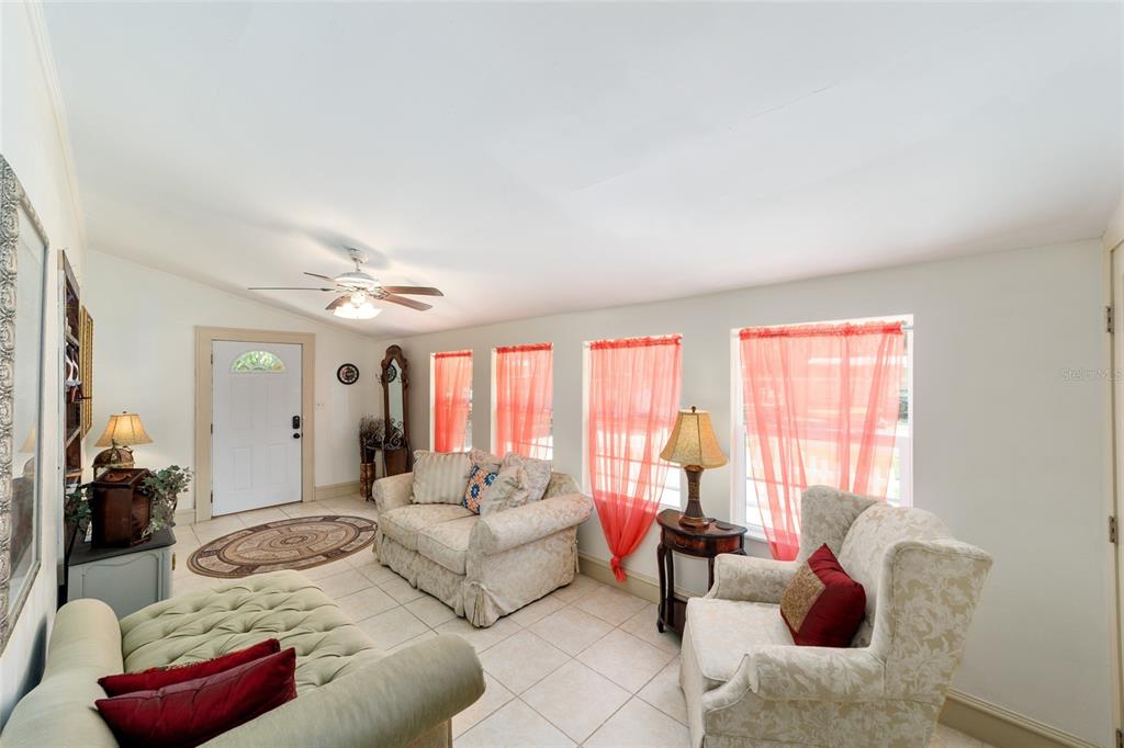 20693 Walnut Street Dunnellon, FL 34431 - Photo 20 of 51 a living room with furniture and a large window