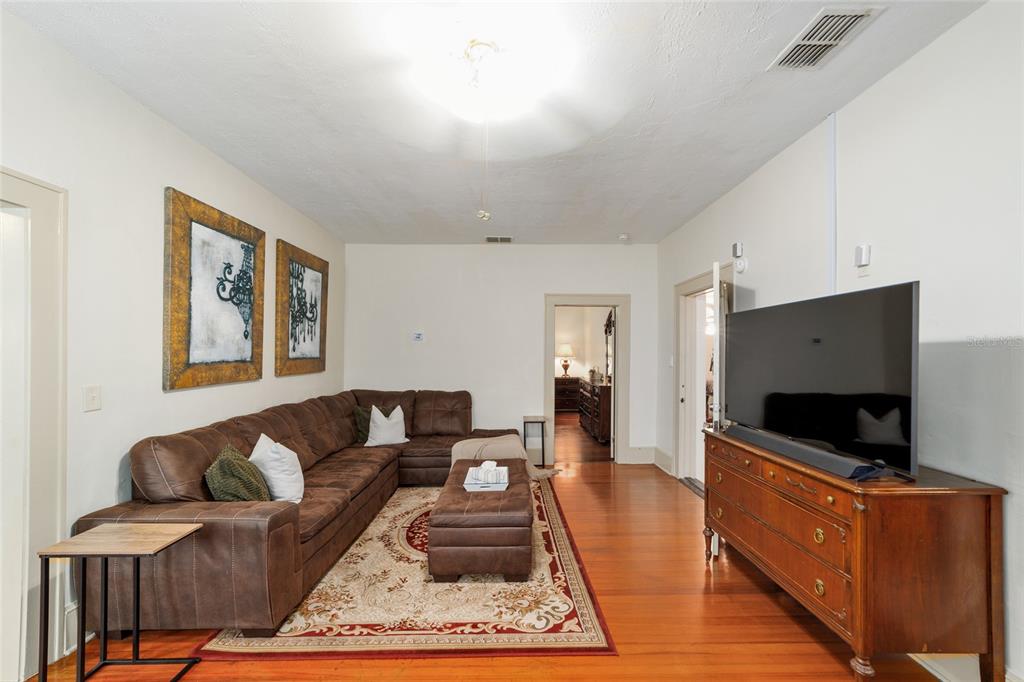 20693 Walnut Street Dunnellon, FL 34431 - Photo 22 of 51 a living room with furniture and a flat screen tv