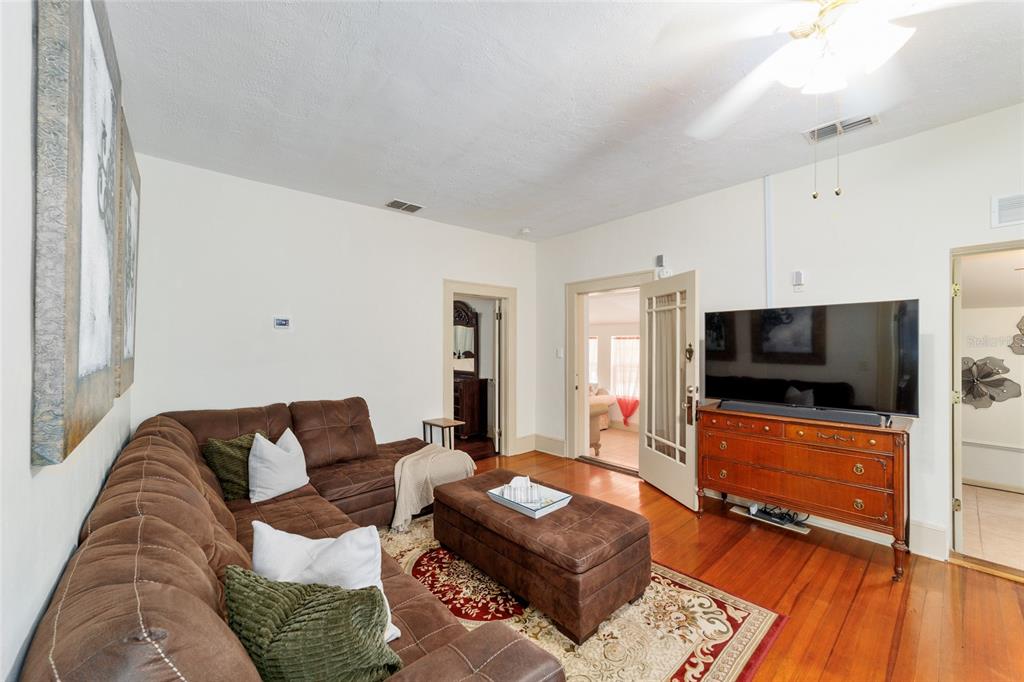 20693 Walnut Street Dunnellon, FL 34431 - Photo 23 of 51 a living room with furniture and a flat screen tv