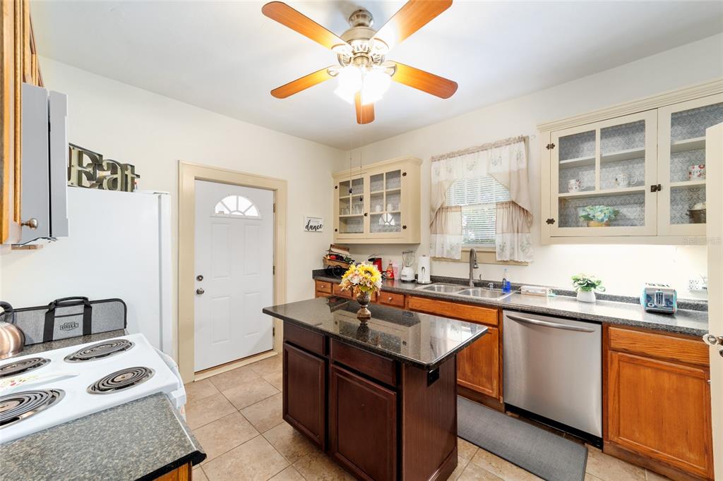 20693 Walnut Street Dunnellon, FL 34431 - Photo 27 of 51 a kitchen with a sink refrigerator and cabinets