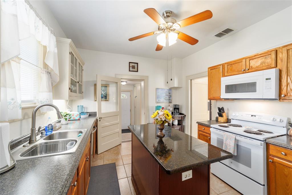 20693 Walnut Street Dunnellon, FL 34431 - Photo 28 of 51 a kitchen with a sink appliances and a counter top space