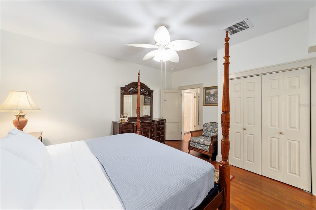 20693 Walnut Street Dunnellon, FL 34431 - Photo 31 of 51 a bed room with a bed a chandelier and a chandelier