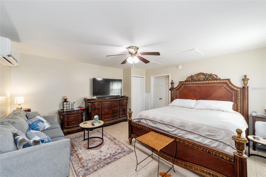 20693 Walnut Street Dunnellon, FL 34431 - Photo 44 of 51 a bedroom with a bed and a couch