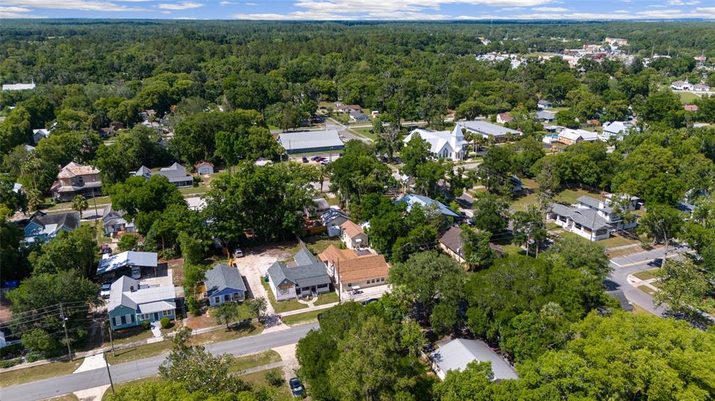 20693 Walnut Street Dunnellon, FL 34431 - Photo 48 of 51 an aerial view of a house with a yard and lake view