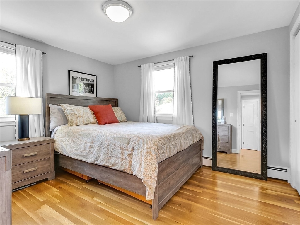 12 Adams Avenue Beverly, MA 01915 - Photo 15 of 31 a bedroom with a bed and a night stand