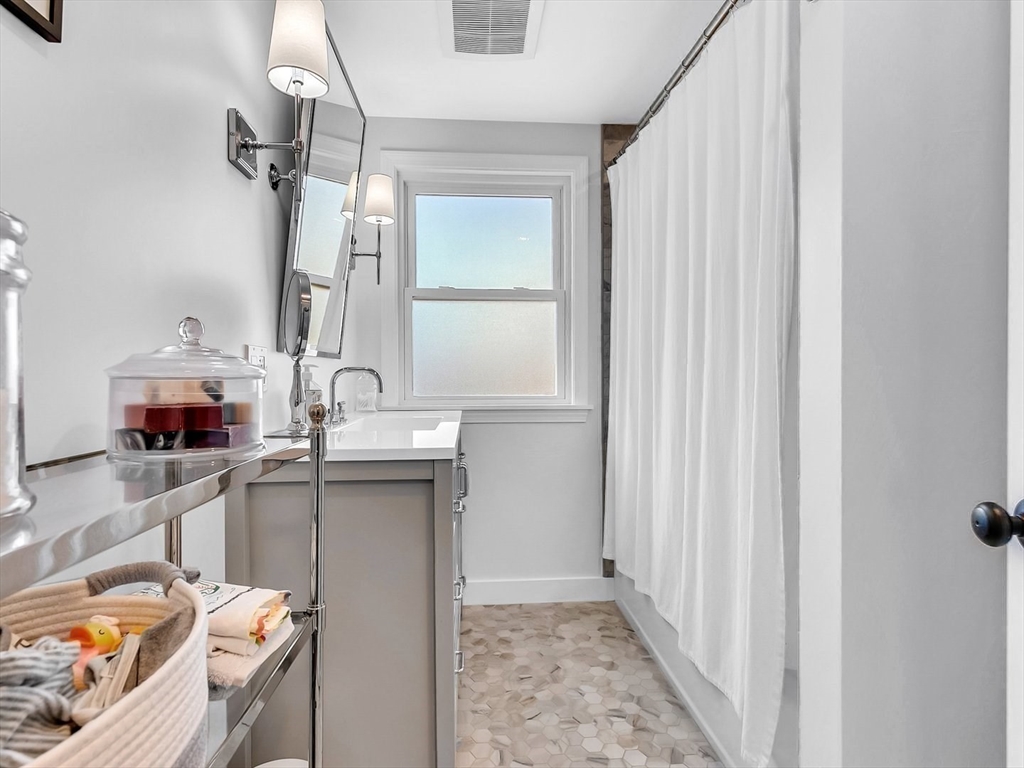 12 Adams Avenue Beverly, MA 01915 - Photo 18 of 31 a bathroom with a sink and a mirror