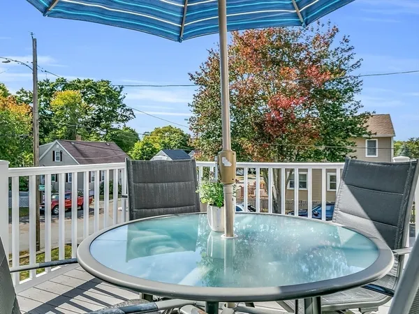 a view of a balcony with furniture