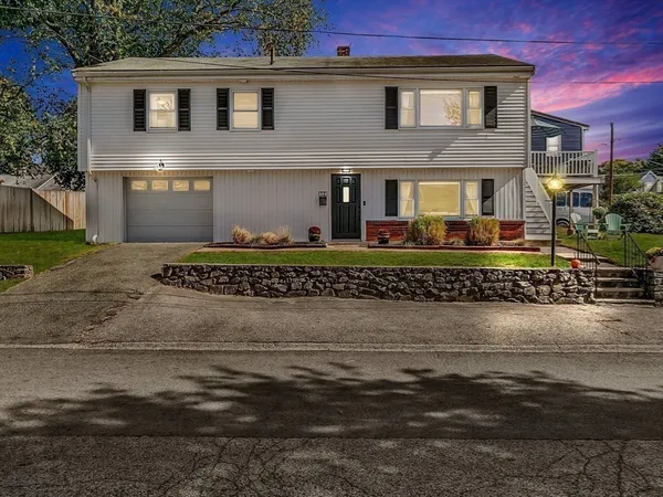 a front view of a house with a yard