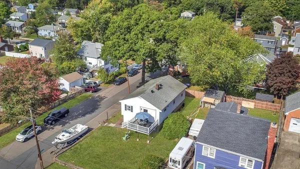 an aerial view of a house with a garden