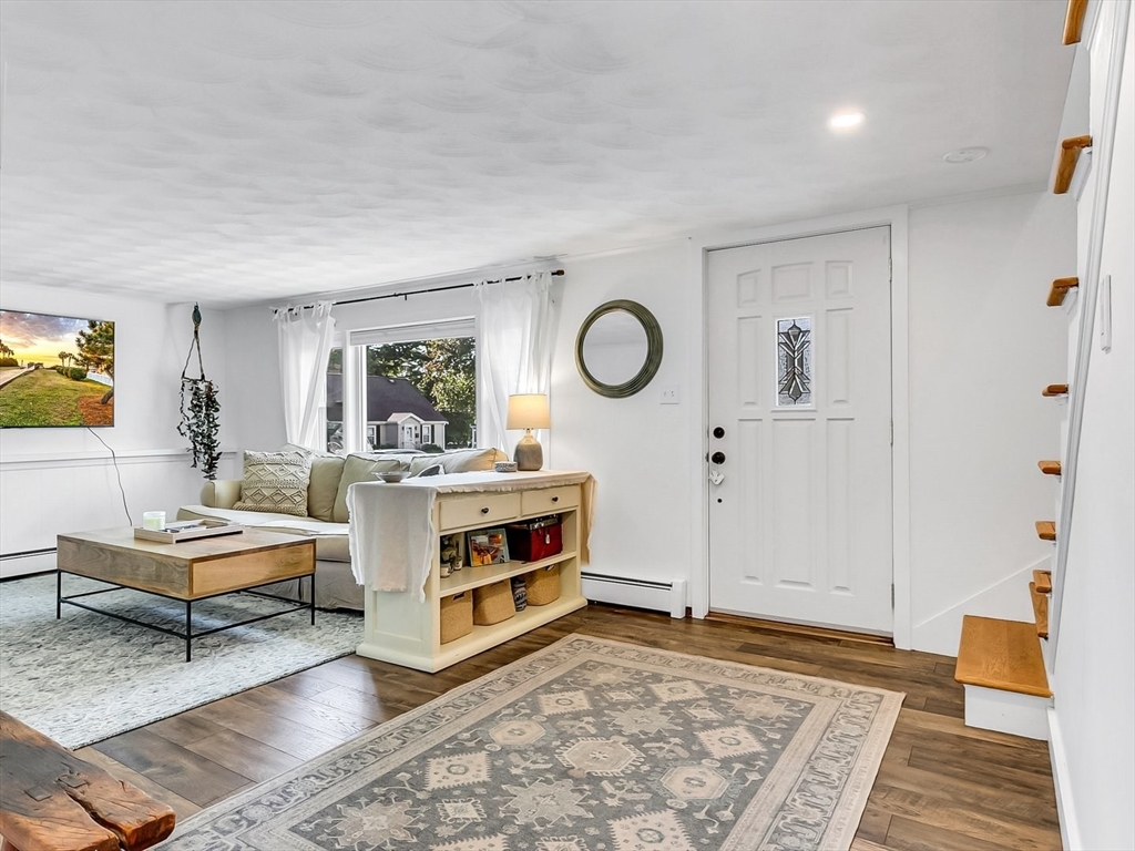 12 Adams Avenue Beverly, MA 01915 - Photo 3 of 31 a living room with furniture and a rug