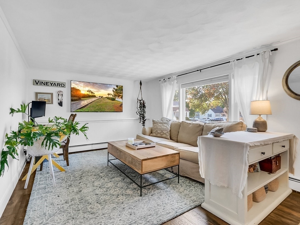 12 Adams Avenue Beverly, MA 01915 - Photo 5 of 31 a living room with furniture and a flat screen tv