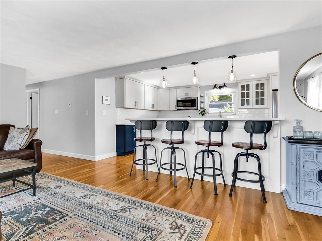 12 Adams Avenue Beverly, MA 01915 - Photo 9 of 31 a view of kitchen with cabinets and wooden floor