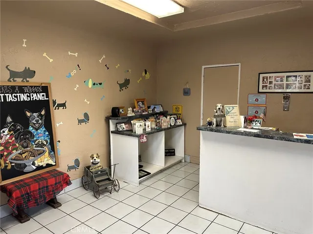 a kitchen with refrigerator and cabinets