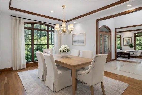 a view of a dining room with furniture window and wooden floor