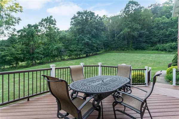 a view of a table and chairs on the roof deck