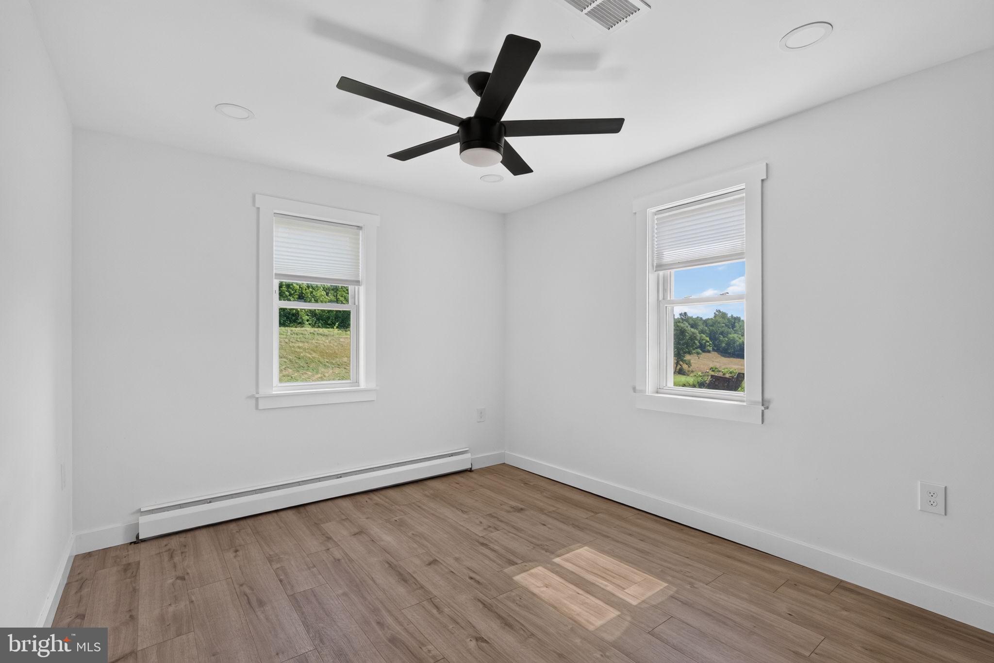 140 Limekiln Road Reading, PA 19606 - Photo 30 of 37 a view of an empty room with wooden floor and a window