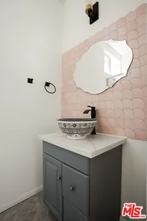 a bathroom with a sink and a mirror