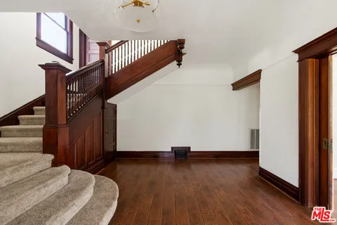 a view of entryway with wooden floor