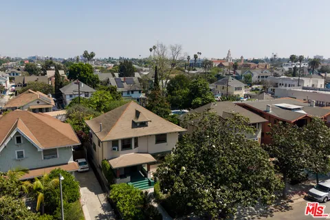 an aerial view of a house with a garden